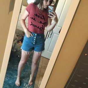 Red striped shirt with text.